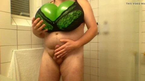 Busty shemale lathers up in the shower with massive boobs