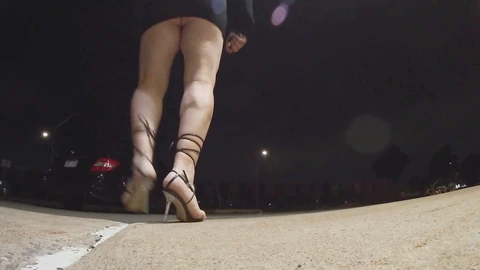 Sissy mature crossdresser shows off in a minidress and heels in a night-time parking lot adventure.